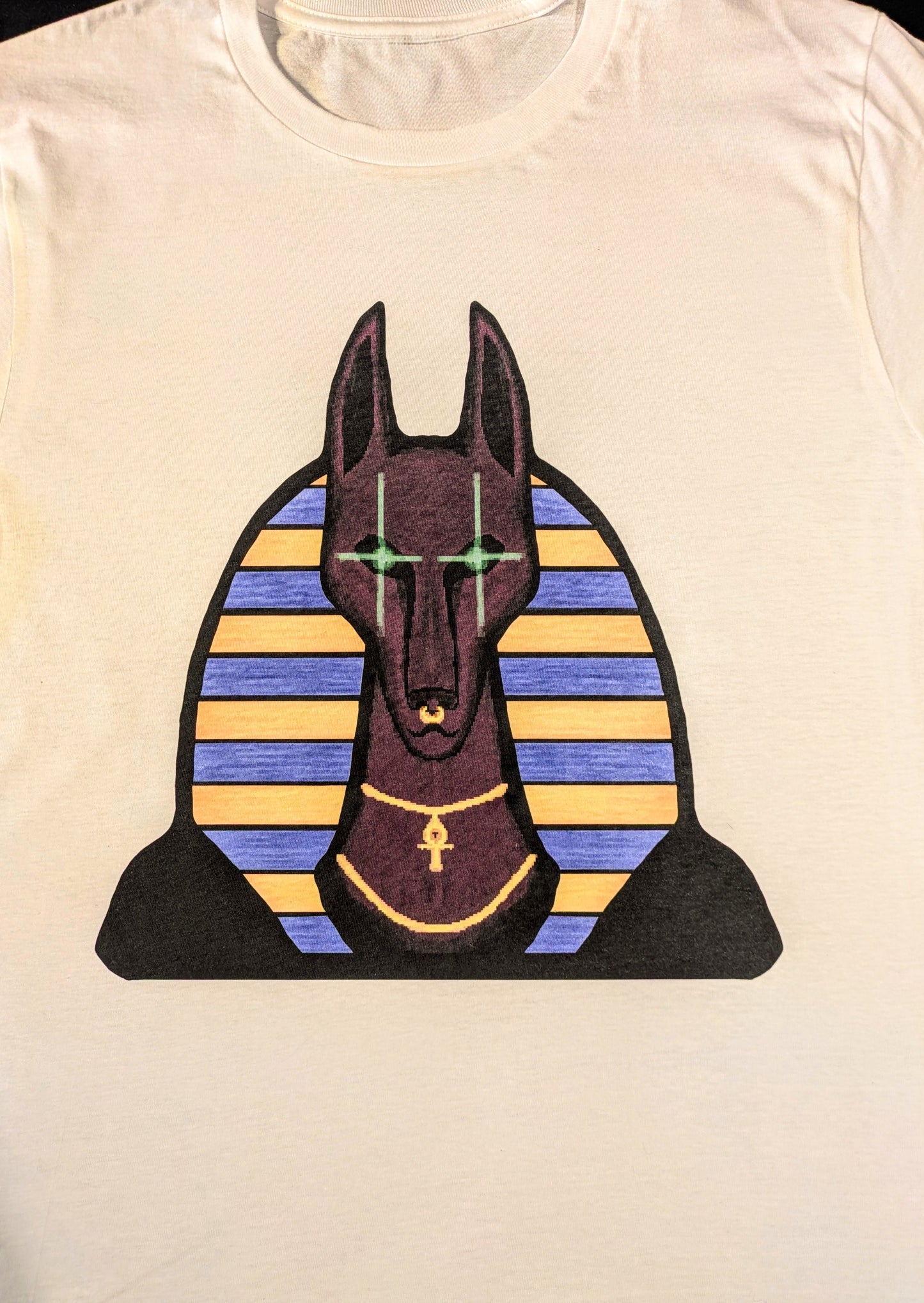 T-shirt with a graphic of the dog-like Egyptian god Anubis 
