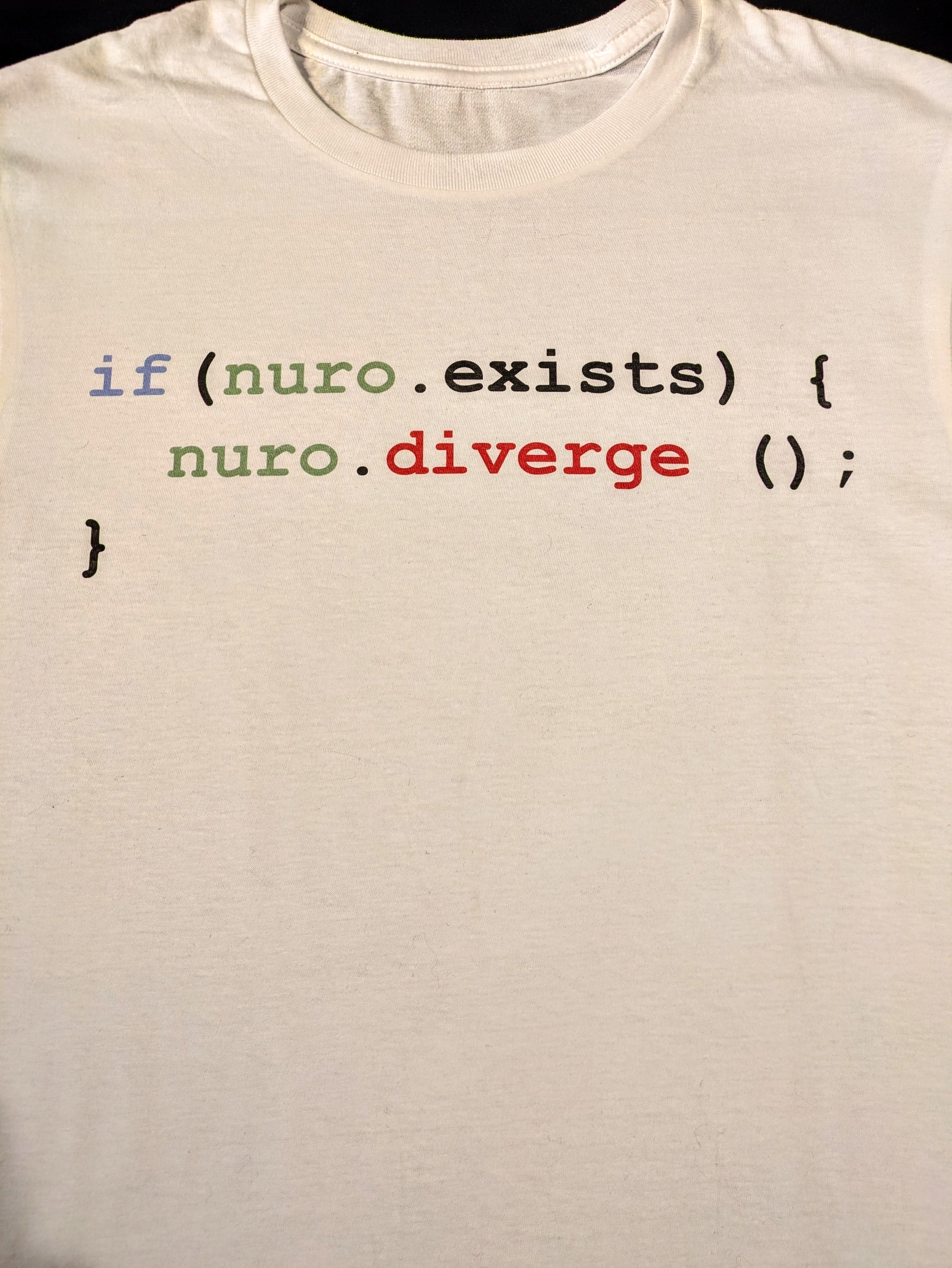 White tee with java code in syntax color stating that if nuro exists then nuro must diverge