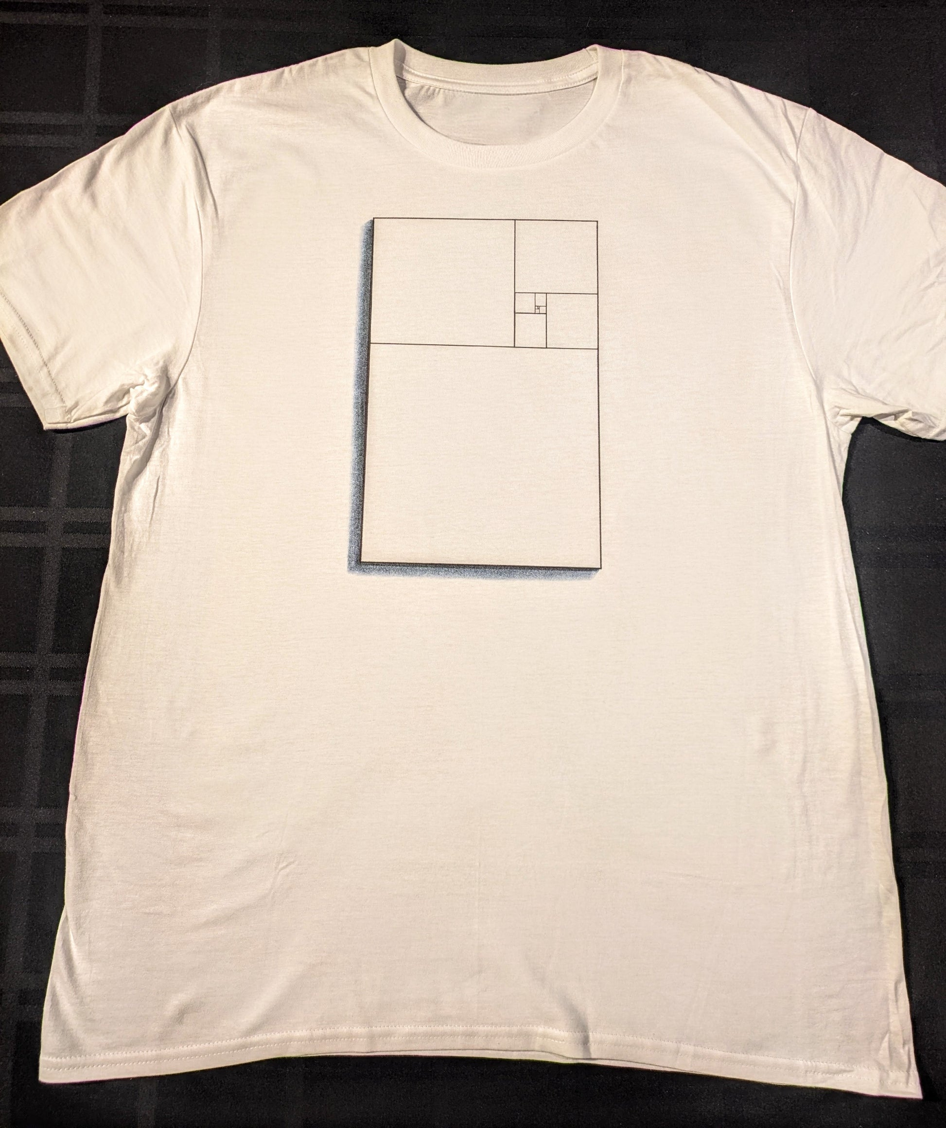 White tee with the golden ratio represented inside a rectangle