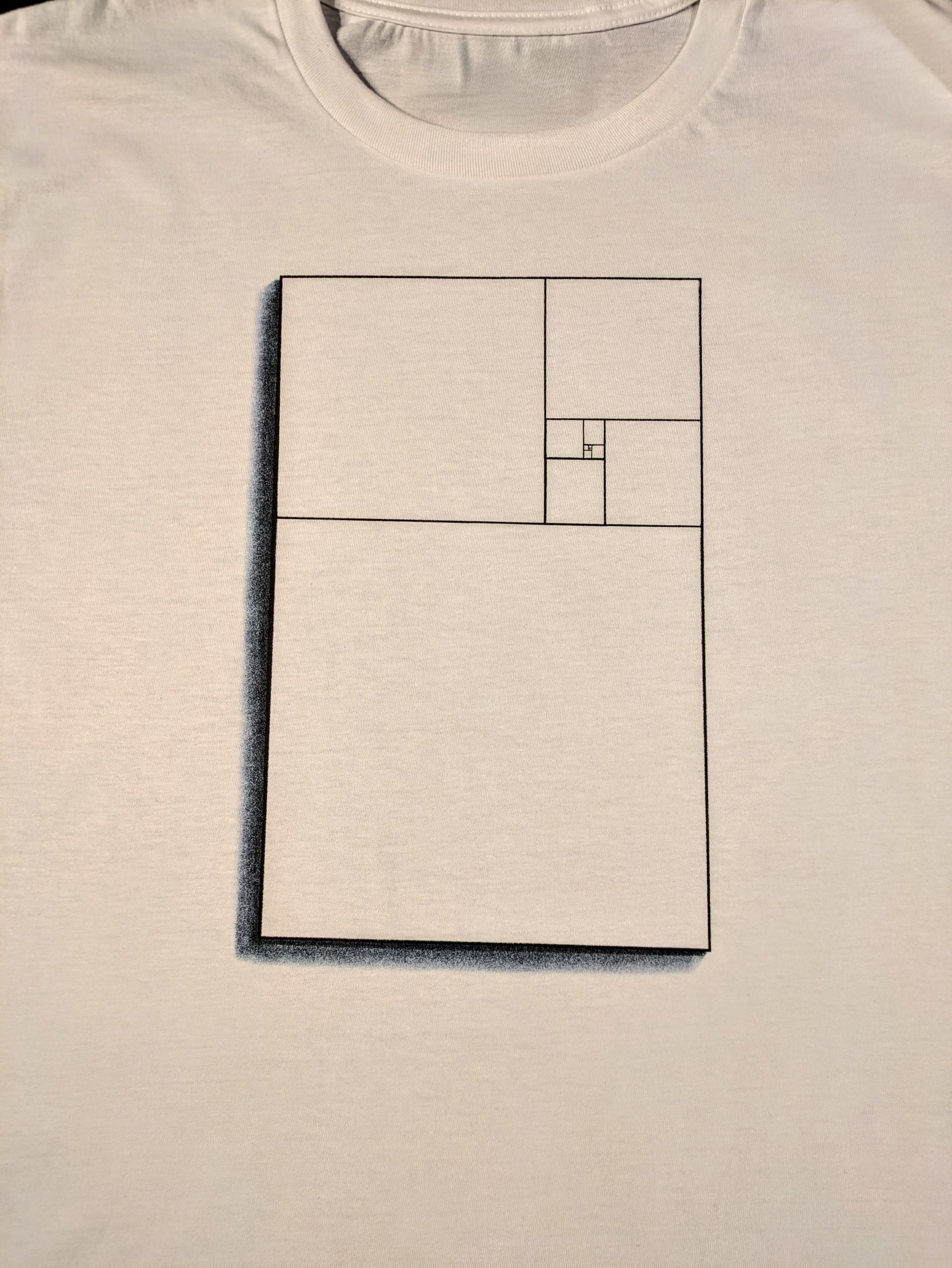 White t-shirt with the mathematical golden ratio represented inside a rectangle 