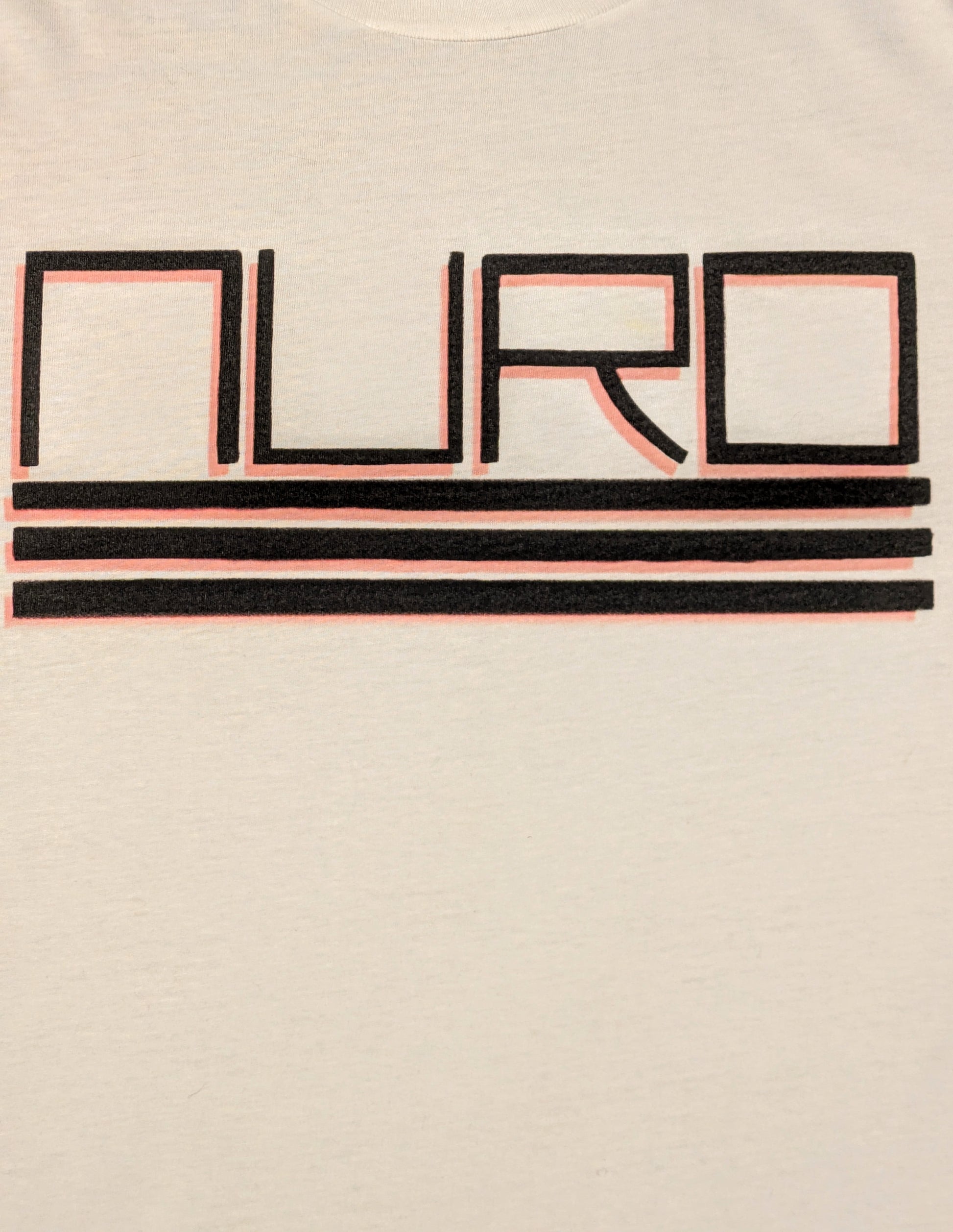 Squared lettering NURO in bold black with three lines underneath and a red drop shadow