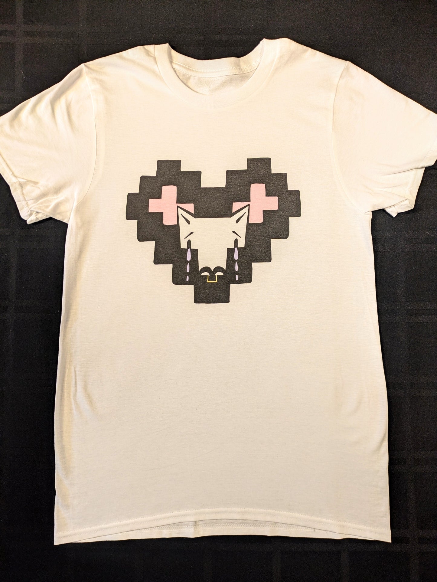 White shirt with a pixel heart and crying Coyote character