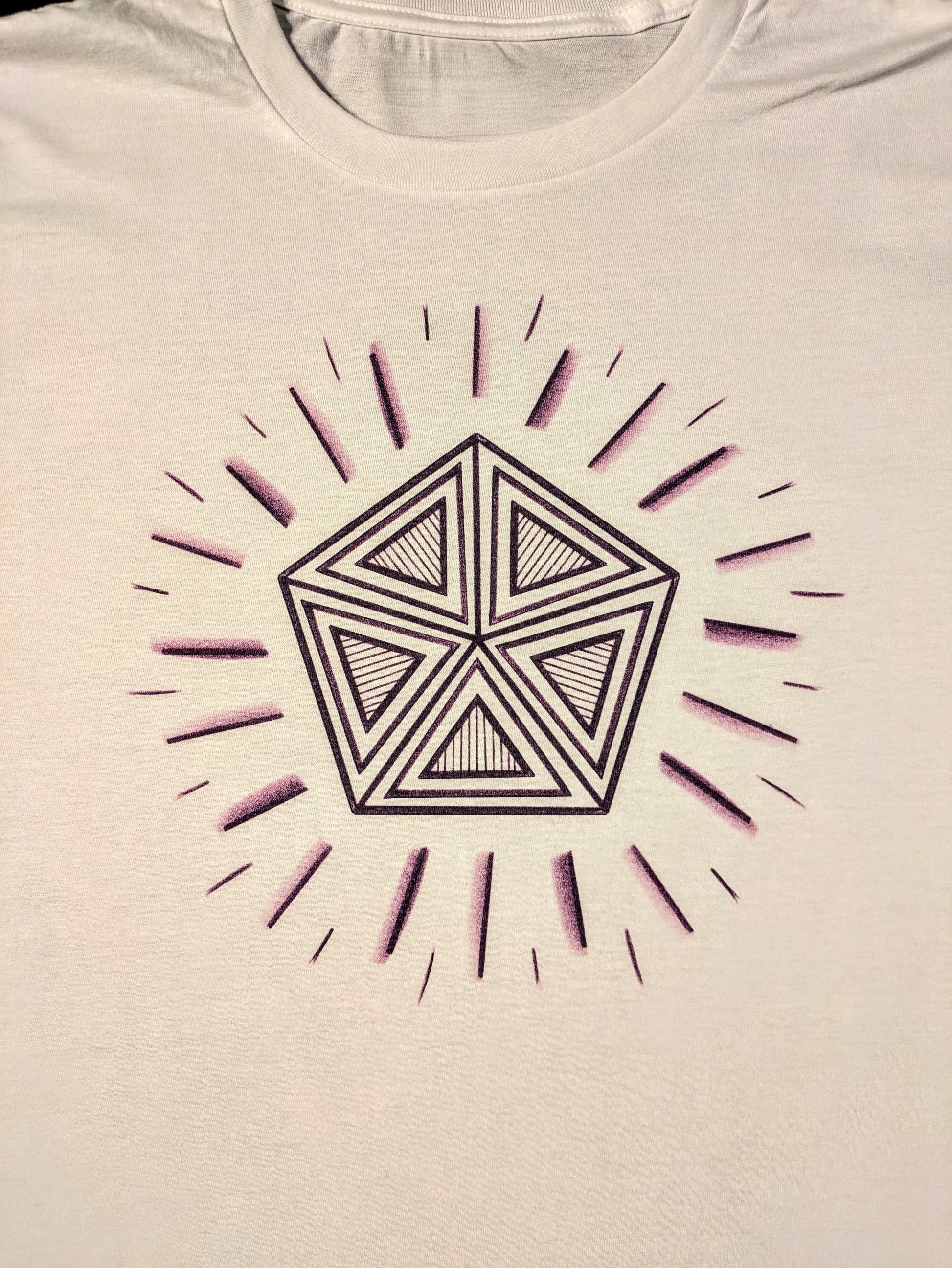 White tshirt with purple pentagon design with radiating purple lines