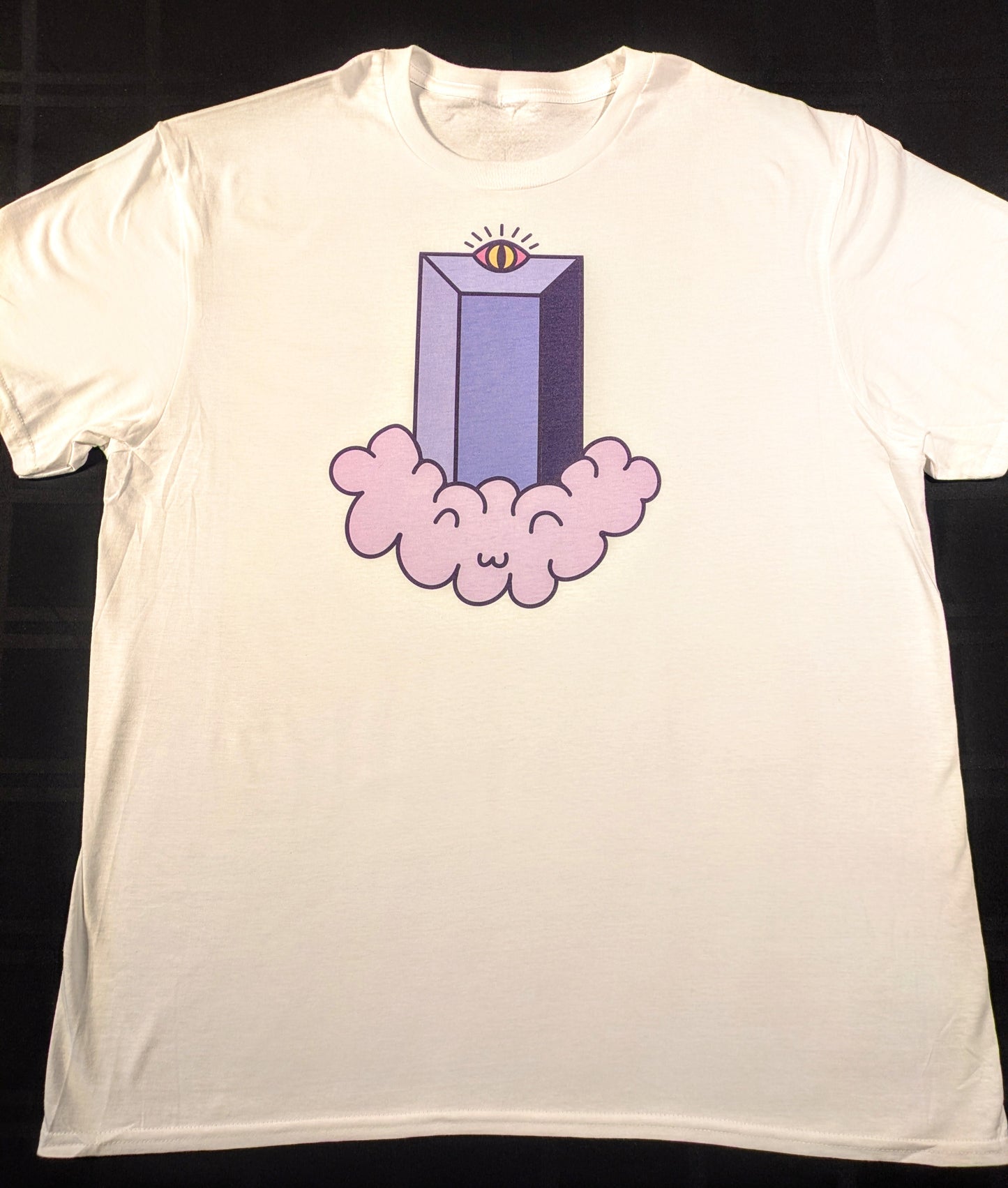 A white t-shirt with a illustrated representation of the Fifth Third Building with a radiant eye at the top sitting on top of a light purple cloud that has a cute smiley face