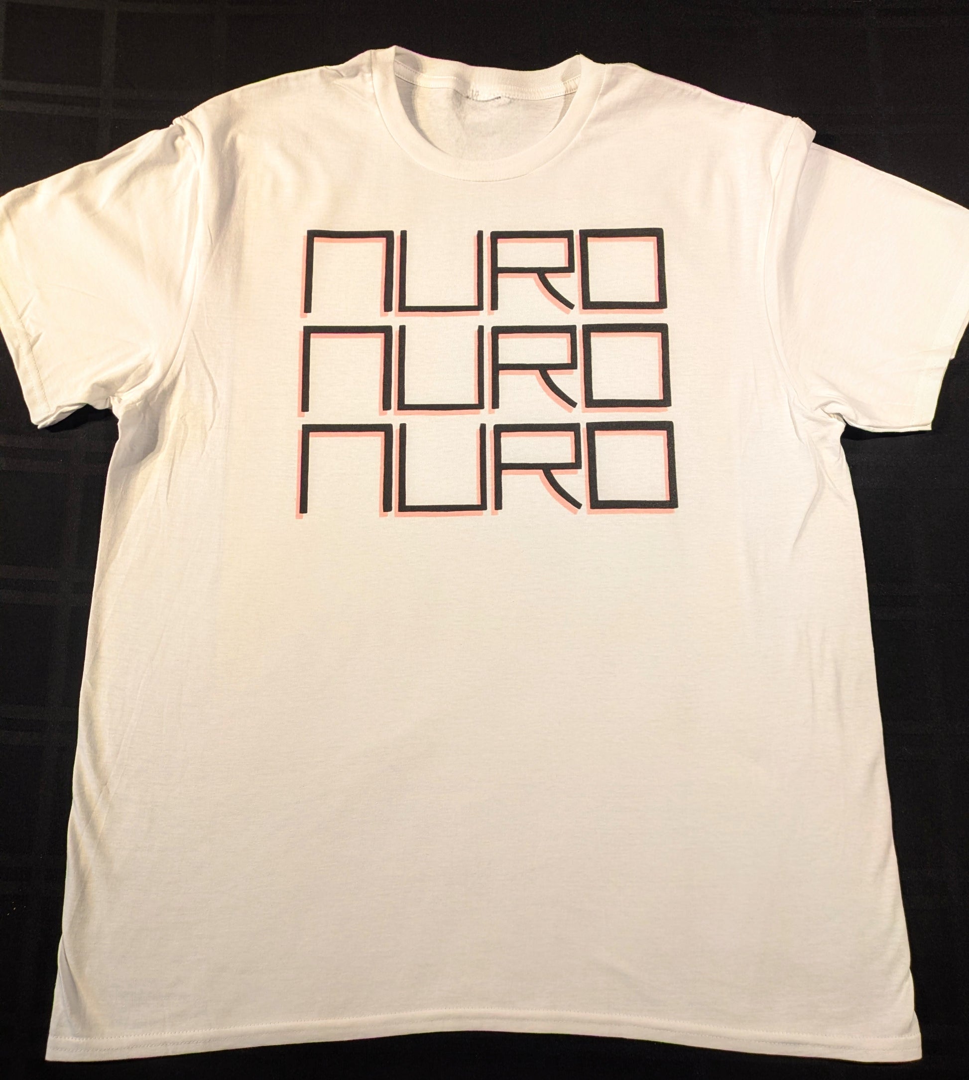 White t-shirt with 'NURO' text printed three times vertically in fine block lettering with a light red dropshadow