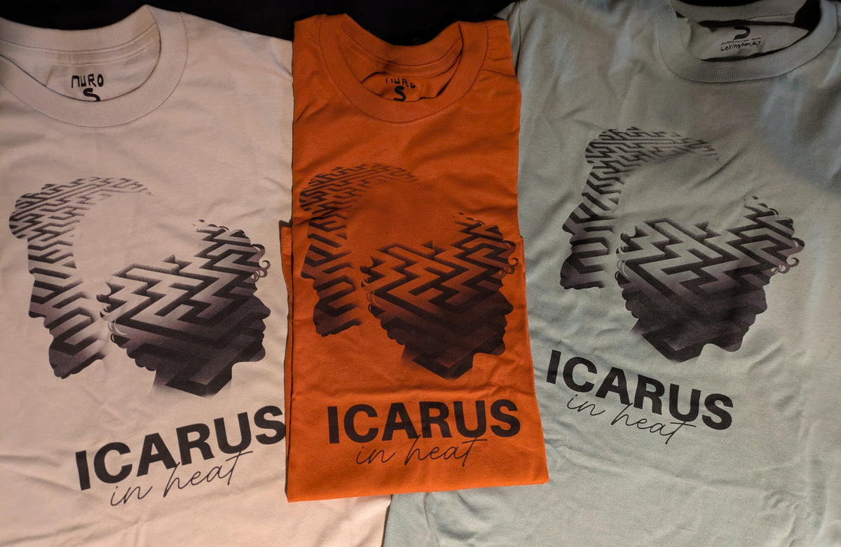 Three t-shirts with 'ICARUS in heat' design on a flat surface